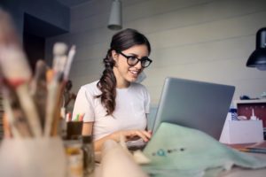 A small business owner works on her laptop.