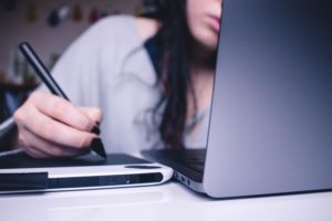 an independent contractor works on a laptop